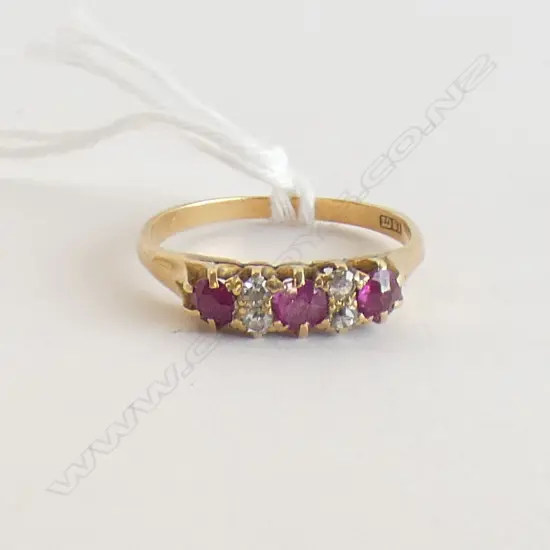 18CT 3 STONE RUBY ? & 4 DIAMOND RING