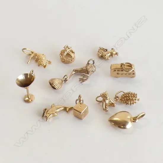 12 9CT YELLOW GOLD CHARMS 13gm. MARTINI GLASS, DOG ETC