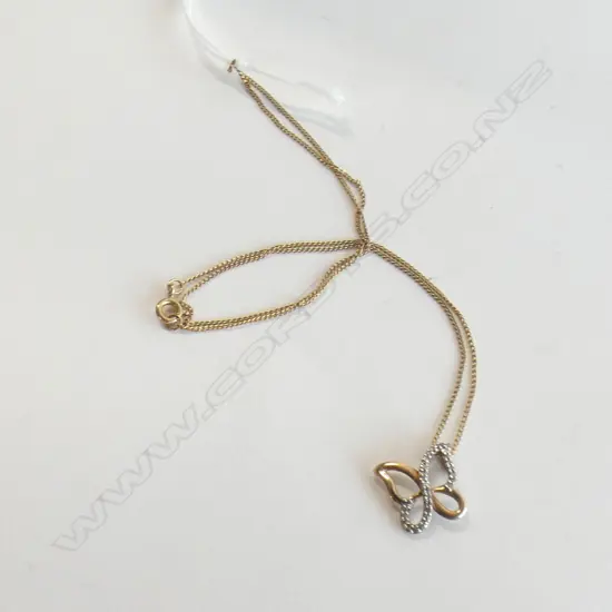 9CT GOLD & DIAMOND BUTTERFLY PENDANT ON SILVER GP CHAIN