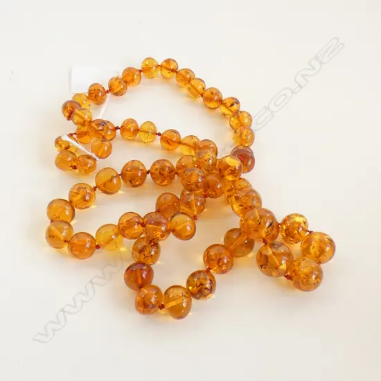 LONG STRING OF AMBER BEADS