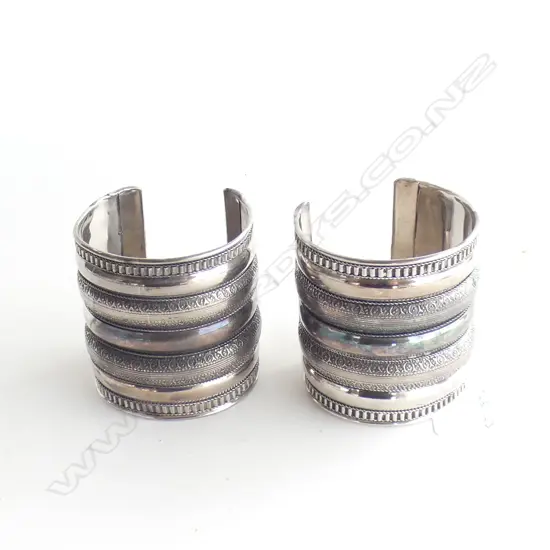 PAIR OF WHITE METAL CUFFS