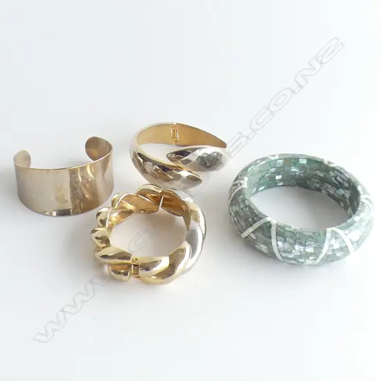 FOUR LARGE COSTUME BANGLES