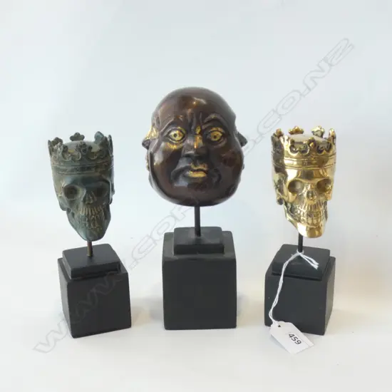 3 BRONZE HEADS ON STANDS; 2 CROWNED SKULLS + 4 SIDED HEAD H.200mm