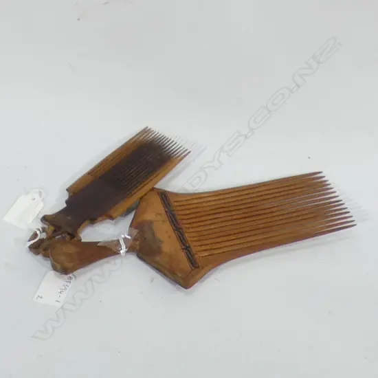 TWO VINTAGE CARVED WOODEN COMBS - LARGEST L 250MM SM WITH ELEPHANT L 160MM