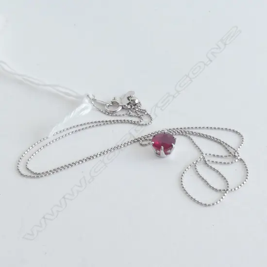 PLATINUM AND RUBY PENDANT WITH CHAIN
