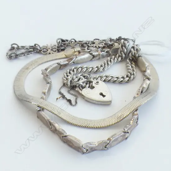 FOUR SILVER BRACELETS