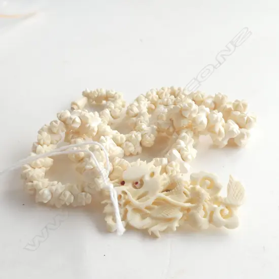 BONE NECKLACE AND BONE DRAGON BROOCH