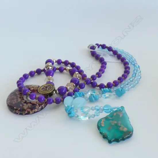 TWO GLASS NECKLACES