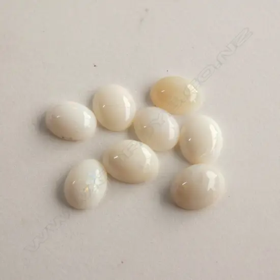 EIGHT OVAL MILKY OPAL STONES 9.45CT