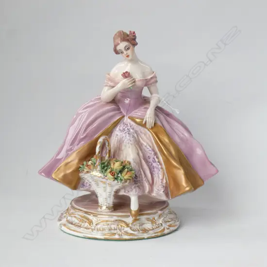 PORCELAIN LADY FIGURINE WITH FLOWER BASKET - ETCHED SIGNATURE TO BASE H 215MM
