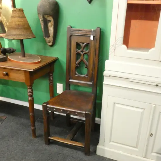 OLD TUDOR STYLE OAK CHAIR. STUDDED LEATHER SEAT