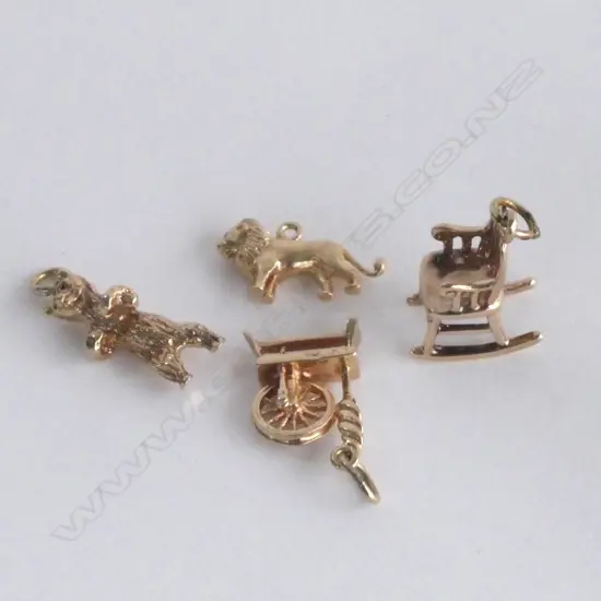 FOUR 9CT GOLD CHARMS 10.5gm