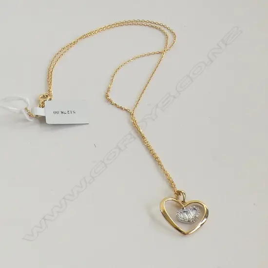 18CT GOLD AND DIAMOND PENDANT SILVER GILT CHAIN