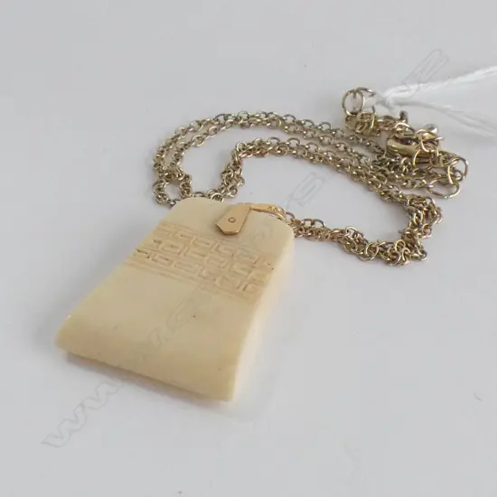 CARVED IVORY PENDANT (25 x 30mm) WITH 15CT GOLD BALE ON PLATED CHAIN