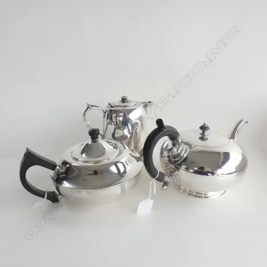 THREE SILVER PLATE TEA POTS