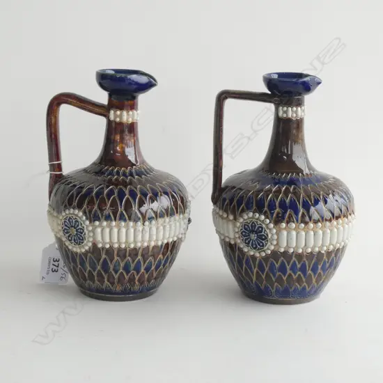 A pair of Royal Doulton Lambeth ewer jugs