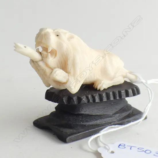 IVORY CARVED LION WITH CAPTURED SNAKE L 80MM