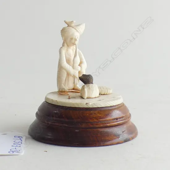 IVORY CARVED SNAKE CHARMER ON WOODEN PLINTH  H 70MM