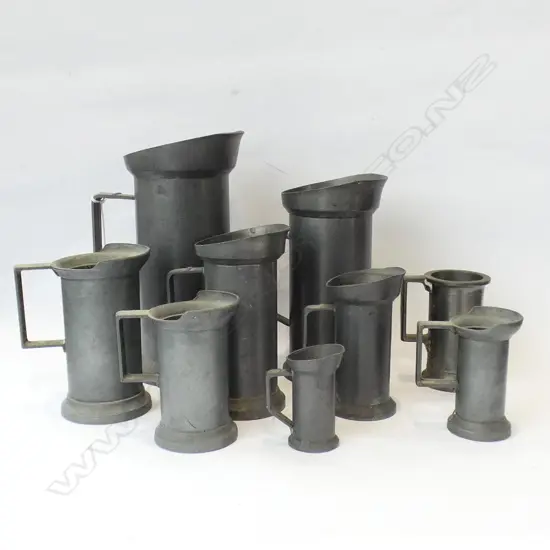 GRADUATING SET OF 9 CONTINENTAL PEWTER MEASURES; 1L TO 2 CENTILITRES H.200mm