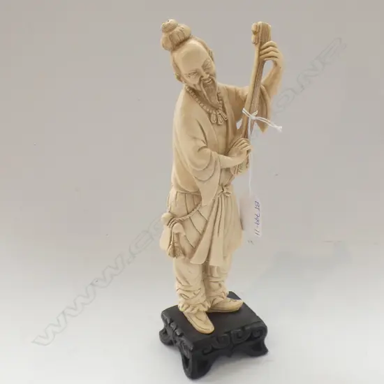 ORIENTAL RESIN FIGURE ON WOODEN STAND; MAN PLAYING INSTRUMENT H 275MM