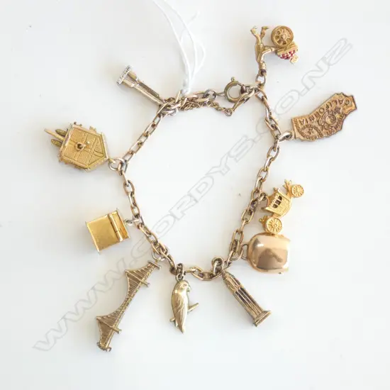 9CT ROSE GOLD CHARM BRACELET (SOME CHARMS GOLD SOME NOT) 27gm