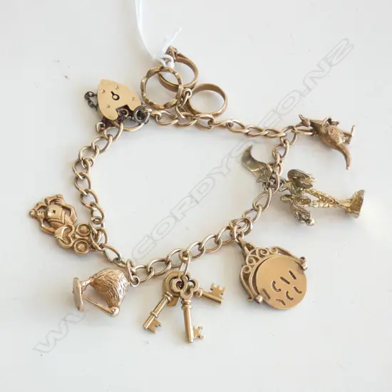9CT GOLD CHARM BRACELET WITH FIVE 9CT GOLD CHARMS (2 not gold) 35gm