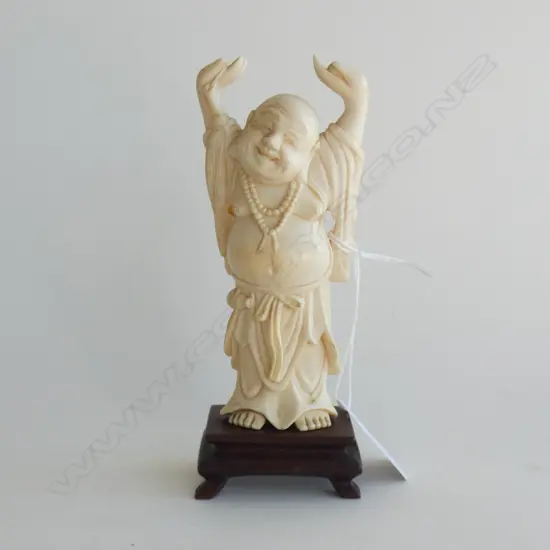 VINTAGE IVORY LAUGHING BUDDHA WITH ARMS UP - ON WOODEN PLINTH H. 150MM