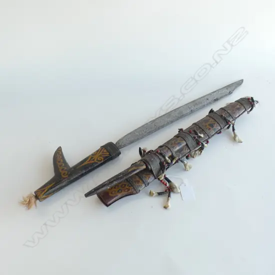 TRIBAL DAGGER IN CASE WITH SEVERAL TEETH ATTACHED TO SCABBARD L 640 MM