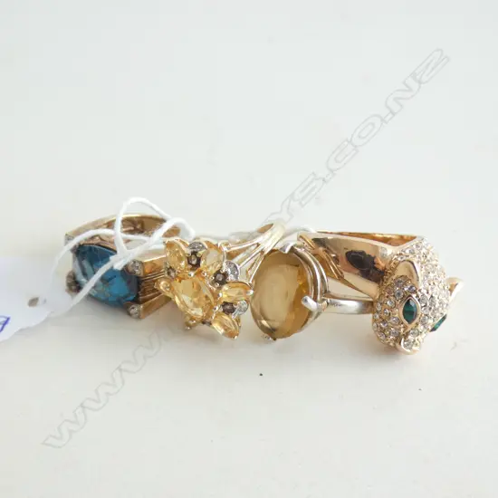 4 SILVER GILT COSTUME RINGS 24 GRAMS