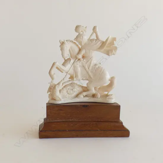 IVORY FIGURINE ON STAND; ST. GEORGE SLAYING THE DRAGON H.105mm