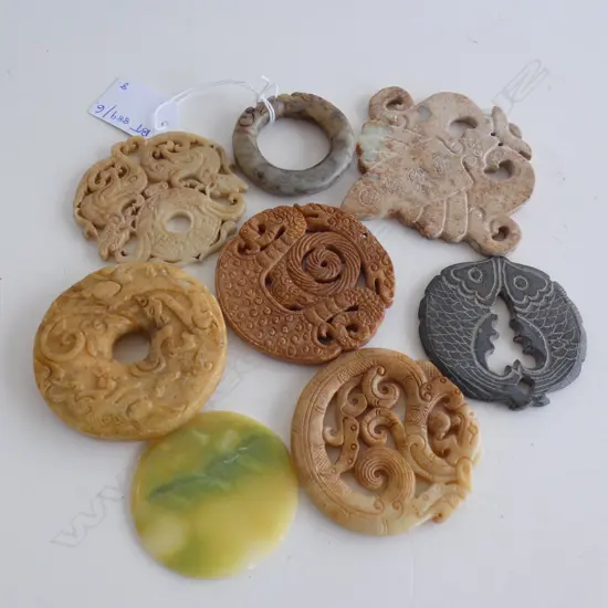8 ASST. CIRCULAR ORIENTAL CARVED STONE DISKS / TOKENS ETC 65mm dia