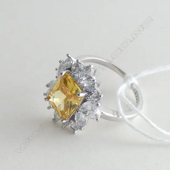 SILVER AND FAUX YELLOW DIAMOND RING