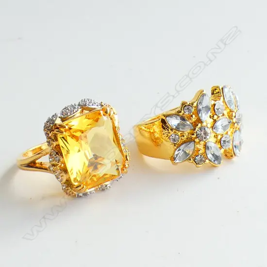 TWO GOLD TONED AND FAUX GEMSTONE RINGS
