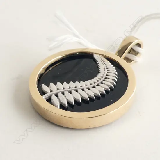 9CT GOLD FRAMED NZ FERN ON BLACK PANEL PENDANT 