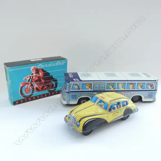 3 TIN TOYS A BOXED MOTORCYCLE NEW YORK TAXI CAB AND BUS
