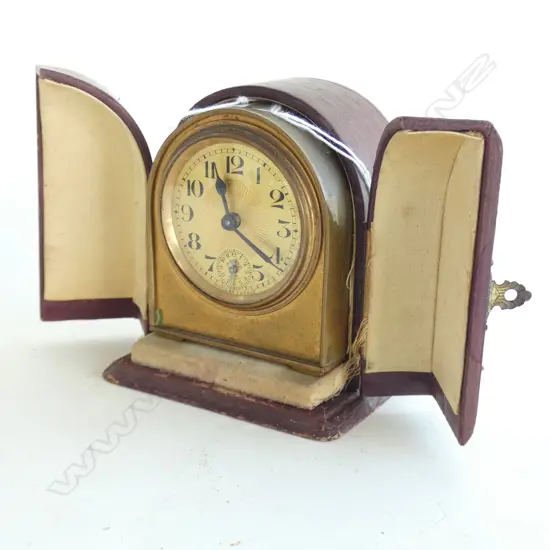 SMALL FRENCH TRAVELLING ALARM CLOCK, LEATHER CASED by Duverdrey & Bloquel. H.100mm