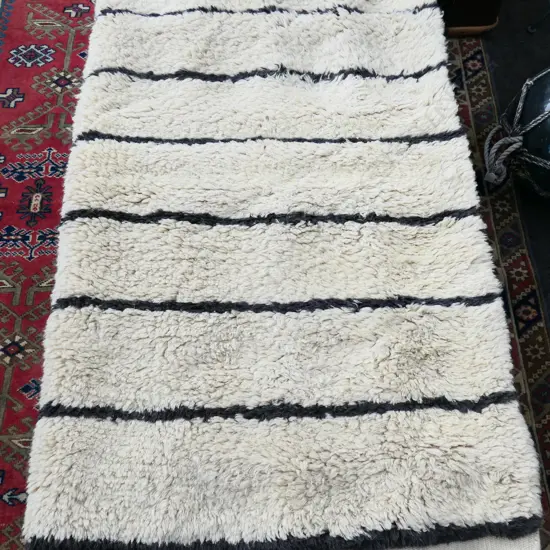 THICK CREAM STRIPED TASSLED RUG, 890 X1740mm