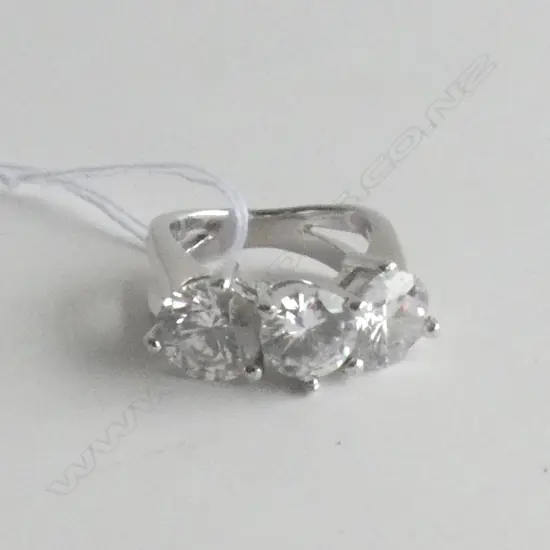 SILVER COLOURED LARGE 3 STONE C.Z. RING