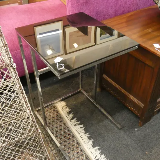 BLACK GLASS TOPPED CHROME TABLE...