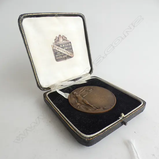 Kohn presented A & P assoc. 1932 bronze medallion