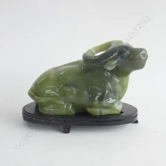 CHINESE GREEN AGATE ? CARVED RECUMBENT BUFFALO L.190MM. ON STAND