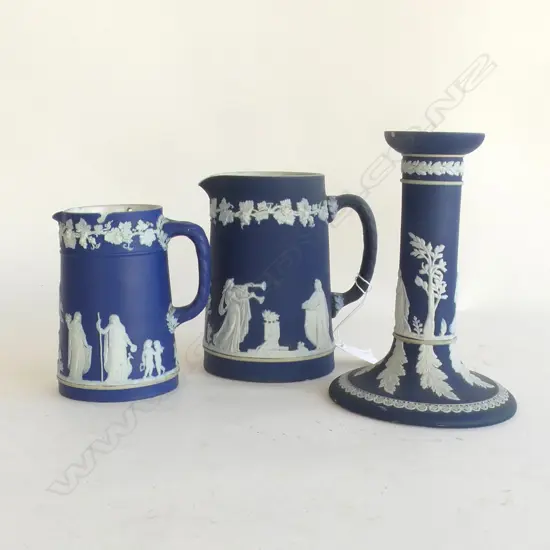 3 PCS WEDGWOOD COBALT JASPERWARE; 2 JUGS (LARGEST H 135MM) & CANDLESTICK (H 165MM) minor chips