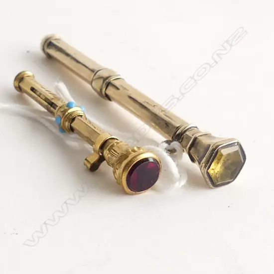 	2 x c1900 GILT ENGRAVED PROPELLING PICKS STONE SET