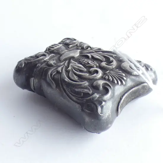 FANCY ANTIQUE EMBOSSED SILVER VESTA W HELMET & SCROLLS