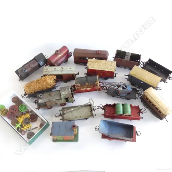 A BOX LOT OF 17 TRAINS & CARRIAGES + BOX OF SPARE WHEELS