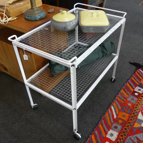 VINTAGE 1980s MICHAEL GLOCK NZ TEA TROLLEY; WHITE METAL & GRIDDED GLASS