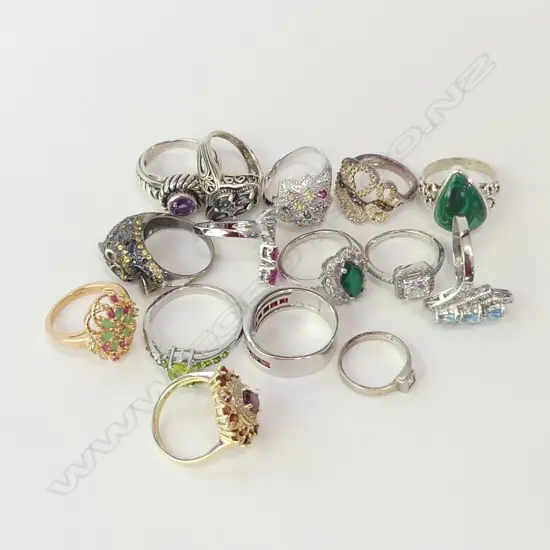 12 STG RINGS (2 SILVER GILT) 63 GRAMS