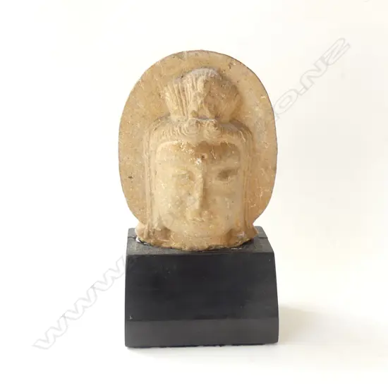 CARVED STONE BALINESE HEAD ON WOODEN STAND  H 210MM