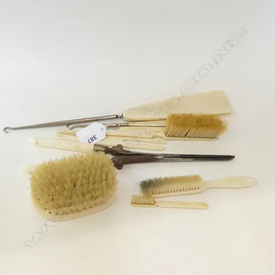 COLLECTION OF IVORY & BONE BACKED BRUSHES, CURLING TONGS, SHOEHORN, ETC.