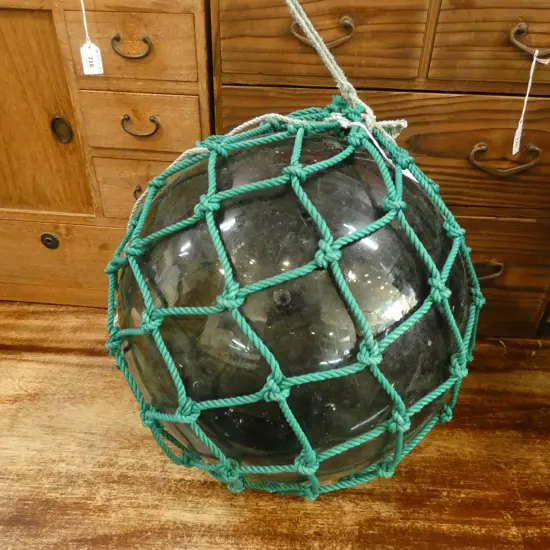 OLD GLASS LARGE FISHING FLOAT WITH GREEN NETTING 390mm dia
